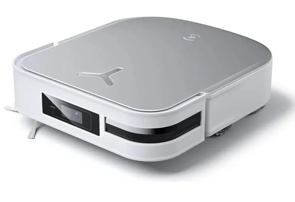 Robô aspirador e passa-pano Ecovacs Deebot X2 Omni com formato quadrado exclusivo para limpeza de cantos. O aparelho está acoplado à sua estação base OMNI multifuncional, que é alta e possui tanques visíveis para água limpa e suja, além de saco de pó para autoesvaziamento.